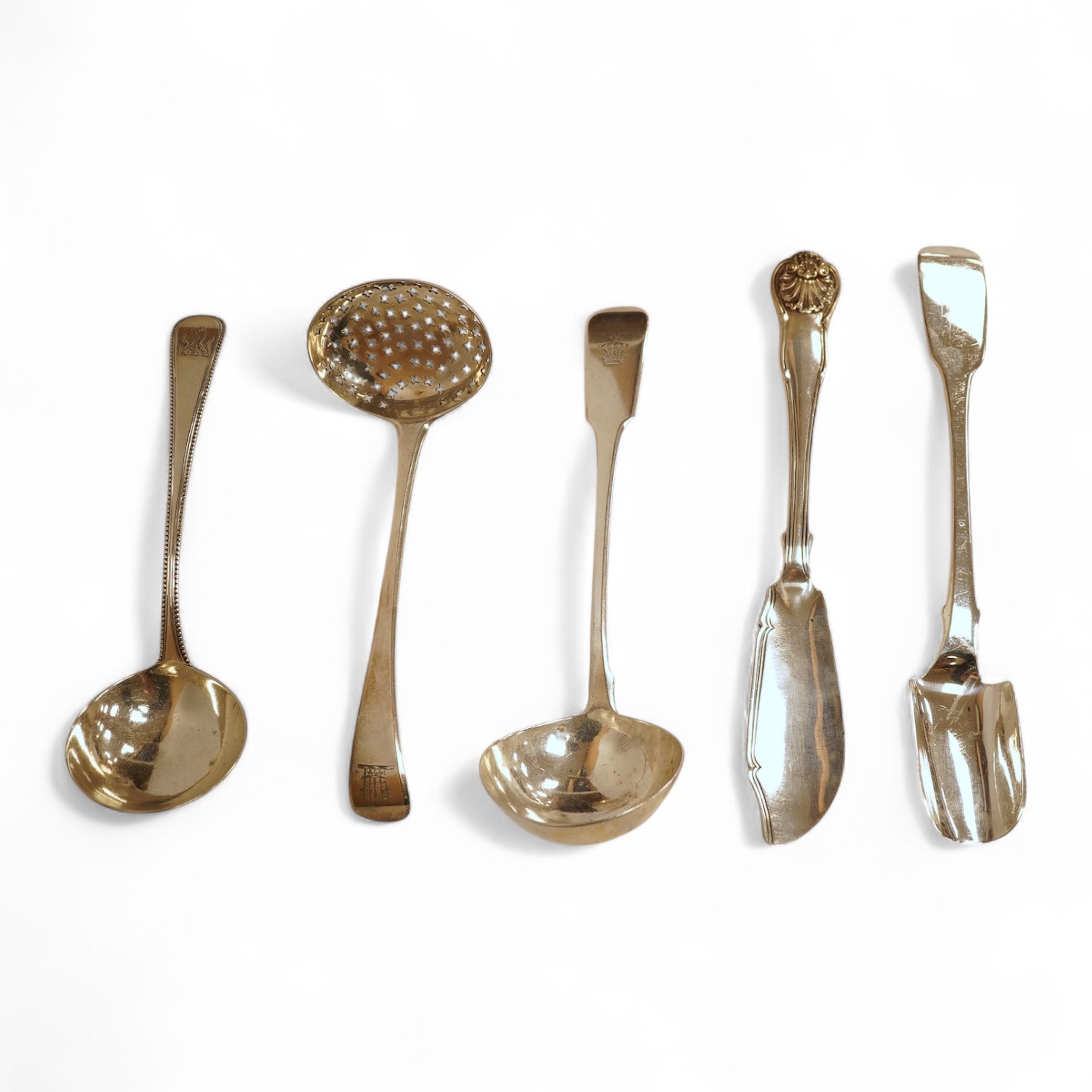A George III silver fiddle pattern stilton scoop, John Lias, London, 1816, 20cm, together with two Georgian silver sauce ladles, a similar sifter ladle and a William IV shell pattern fish knife, 8.9oz.